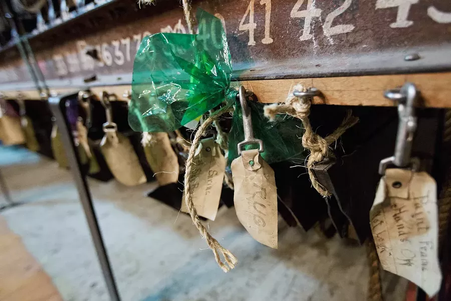 Tags attached to a backdrop pulley system in the Auditorium. - YOUNG KWAK