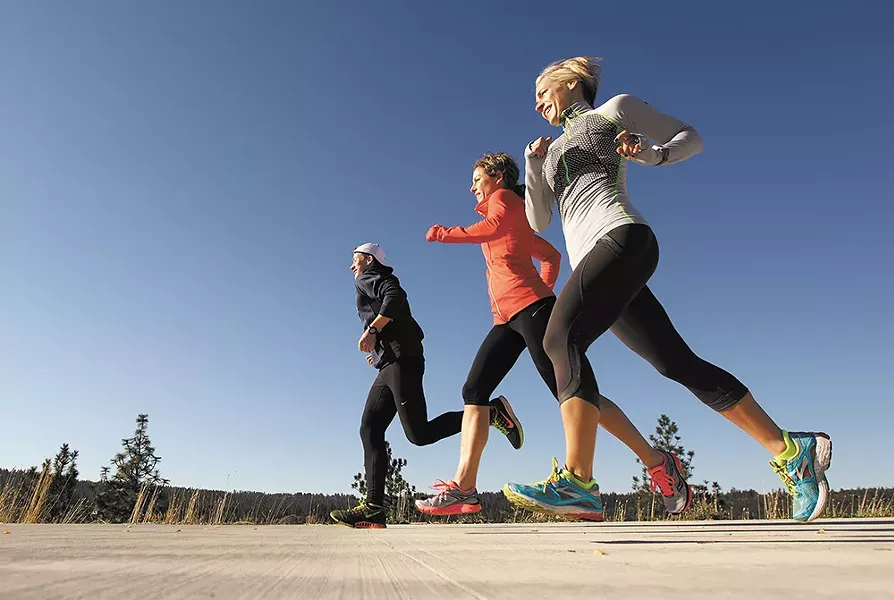 Tate Kelly, Michelle Neill and Carol Hunter on the Centennial Trail in West Central Spokane.
