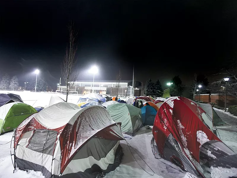 \"Tent City,\" as it\'s become known, is home to hundreds of Gonzaga students hoping to get close to the court for big games. - YOUNG KWAK