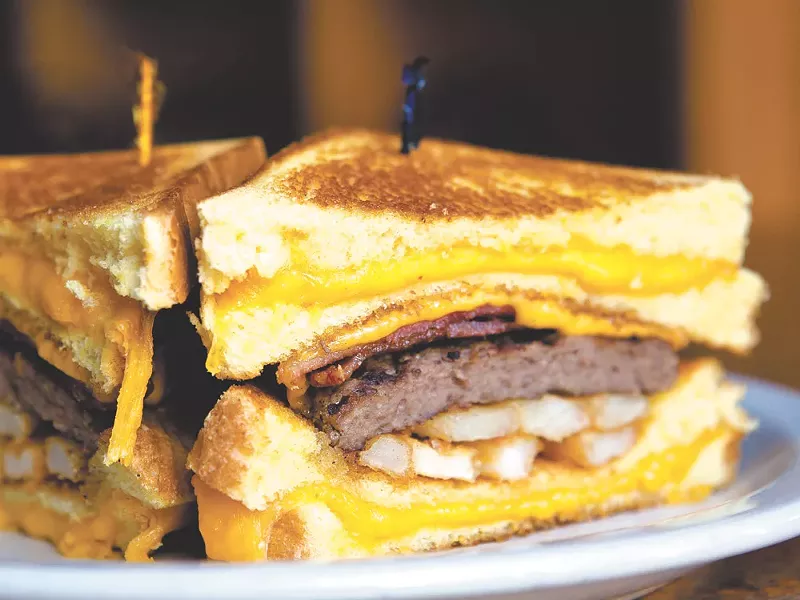 The Billy Breen burger uses grilled cheese sandwiches for buns. - STEPHEN SLANGE