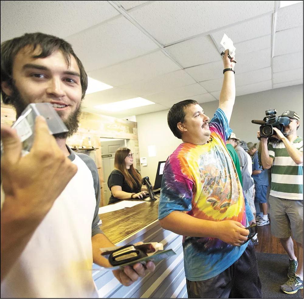 The inaugural customers at Spokane Green Leaf, the first retail shop to open in the area. - YOUNG KWAK PHOTO