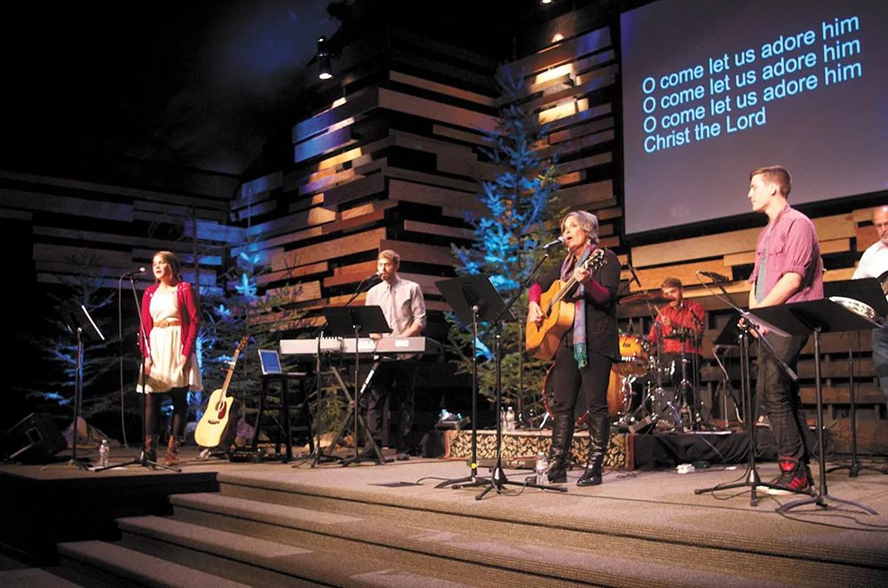 The Long family, (left to right) Meghan, Curran, BethAnn, Riley, Colin and Bill sing together at Summit Church. - SAMUEL SARGEANT