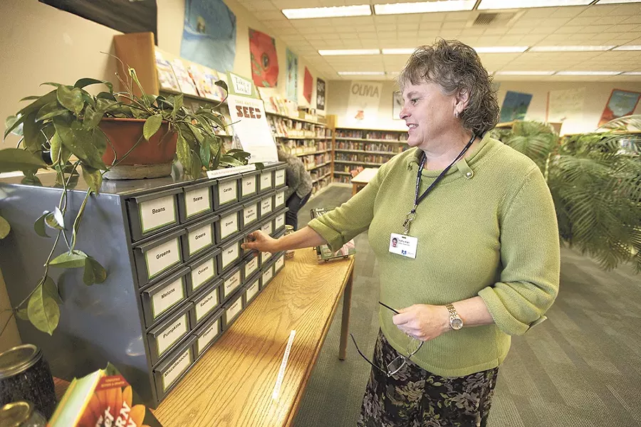 The Otis Orchards seed library has lent hundred of seed packets since launching in February with the help of supervisor Kathy Allen. - YOUNG KWAK