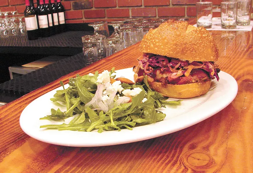The pulled pork sandwich pairs well with the beer at Daft Badger. - CARRIE SCOZZARO