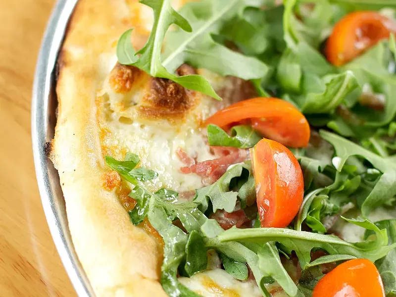 Three years after opening, pies like the prosciutto pizza continue to make South Perry a neighborhood favorite.