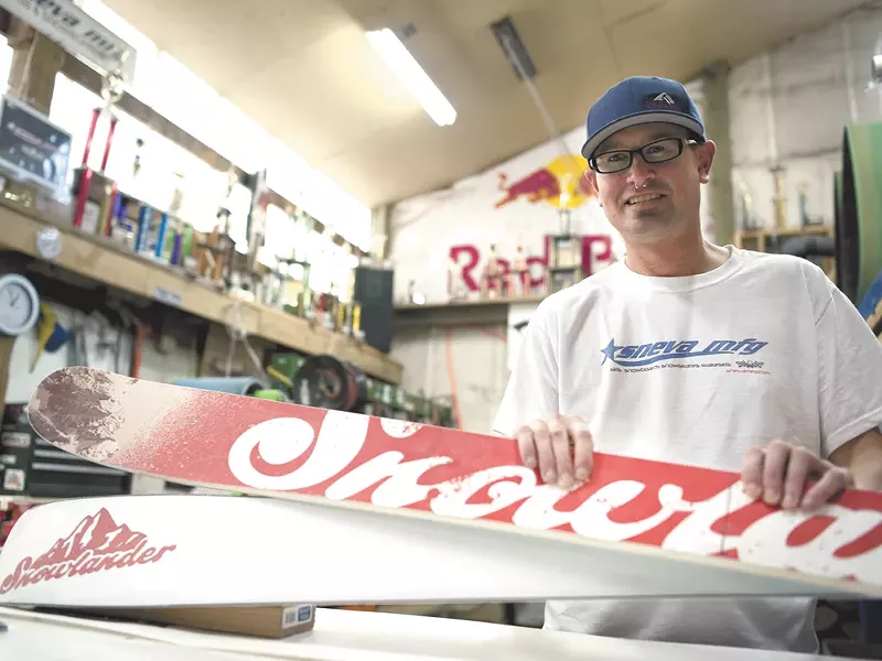 TJ Sneva with a pair of custom skis he was hired to build for Snowlander. - CHRISTIAN WILSON
