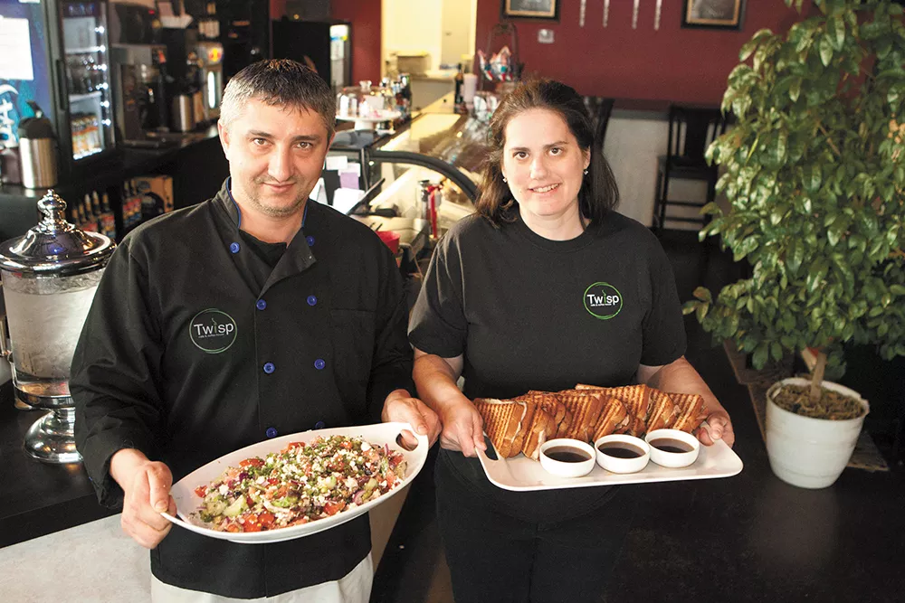 Twisp Cafe owners Bobby (left) and Stacy Taninchev with a Greek salad and French dip panini. - MEGHAN KIRK