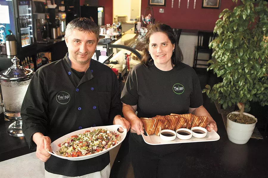 Twisp Cafe owners Bobby (left) and Stacy Taninchev with a Greek salad and French dip panini. - MEGHAN KIRK