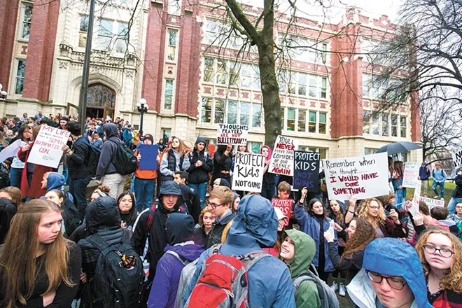 Students walk out of Lewis and Clark High School to protest gun violence earlier this year. - JEFF FERGUSON PHOTO