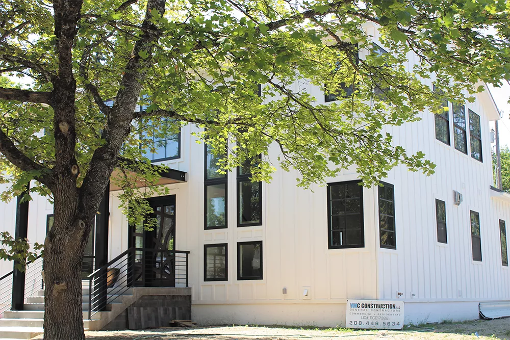 Lisa Whitehead did all the interior and exterior design for her custom home in Coeur d'Alene. One challenge was sourcing the home's Anderson 100 Series black trim windows. - YOUNG KWAK