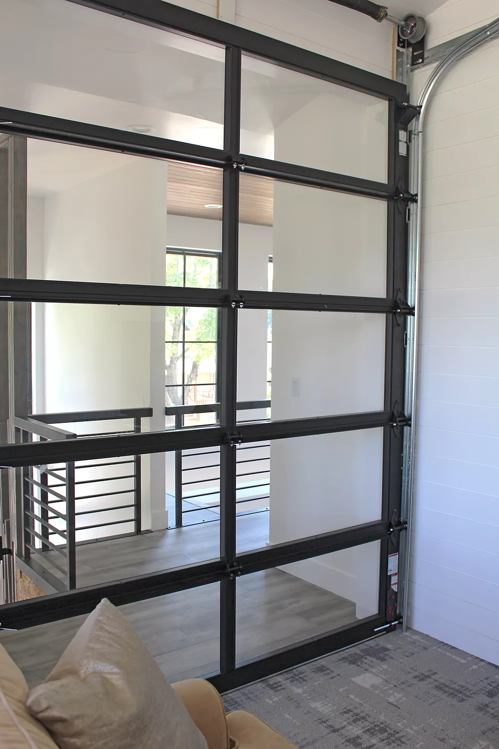 "Things get to evolve when you are doing a custom house," says Lisa Whitehead. One change was the addition of this interior glass garage door. - LISA WHITEHEAD PHOTO