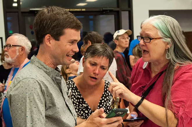Former Spokane County Democrats chair Andrew Biviano and his wife, Amy Biviano, marvel at the results pouring in. - DANIEL WALTERS PHOTO