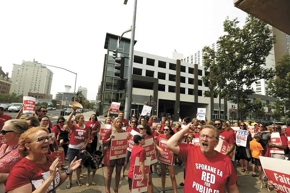 Spokane teachers picketed outside the district office last week, calling for a raise in advance of contract negotiations. - YOUNG KWAK