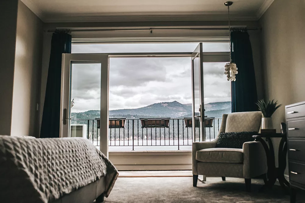 The Wozow master suite features soft colors, with an occasional pop of blue to complement, but not compete with , the sweeping Liberty Lake view. - ALICIA HAUFF PHOTO