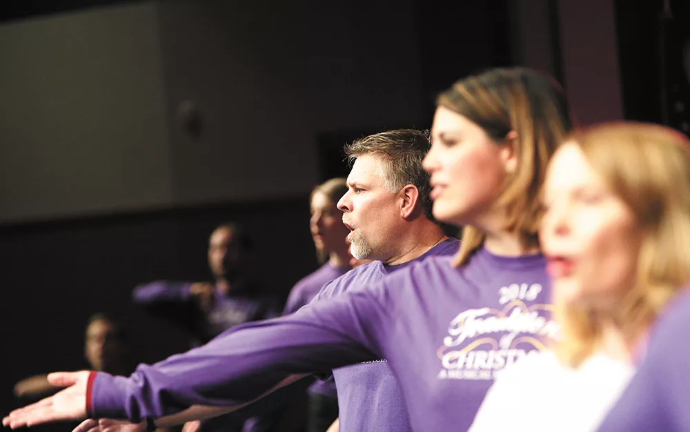 Kevin Walker (center) is one of four family members involved in the Traditions of Christmas show this year. - YOUNG KWAK