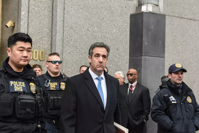 Michael Cohen, center, the former lawyer for President Donald Trump, exits federal court after his sentencing in Manhattan, Dec. 12, 2018. Cohen said he knew arranging payments during the campaign to quiet two women who claimed to have had affairs with the candidate was wrong. He said Trump knew it was wrong at the time, too. - STEPHANIE KEITH/THE NEW YORK TIMES