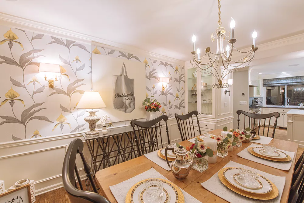 The large scale, contemporary botanical print wallcovering in designer Bridgit Wilson's dining room is from Cole & Son, a British company that's more than a hundred years old and specializes in hand-printed papers. - ERICK DOXEY PHOTO