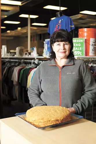 Global Neighborhood Thrift's production supervisor Svitlana Negodaieva is baking a traditional Russian honey cake for the upcoming dinner. - YOUNG KWAK PHOTO