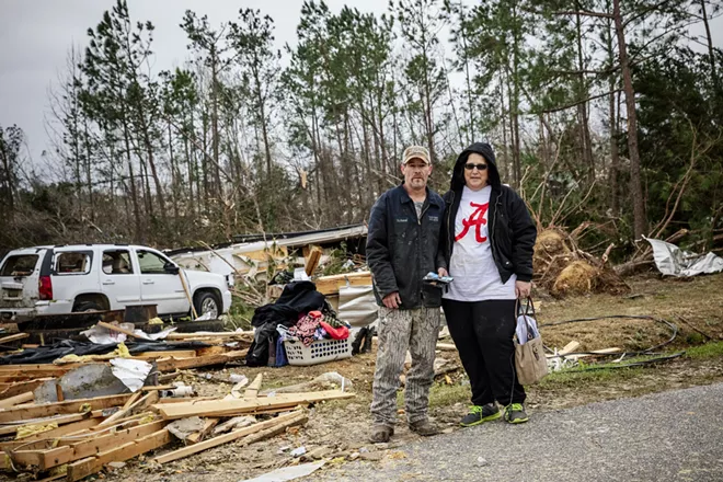 Kevin and Becky Boyd as they recovered items from the rubble of their mobile home, after they said it flipped over as a tornado swept through the area in the Beauregard community of Lee County, Ala., March 4, 2019. Search-and-rescue workers rushed on Monday to help communities that were pummeled by several tornadoes that killed at least 23 people, wrecked homes and uprooted trees in central Alabama. - AUDRA MELTON/THE NEW YORK TIMES