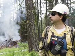 In this 2013 photo, Kent Contreras with the Forest Service helps oversee a wildfire training exercise near Usk, about an hour north of Spokane. - JACOB JONES PHOTO