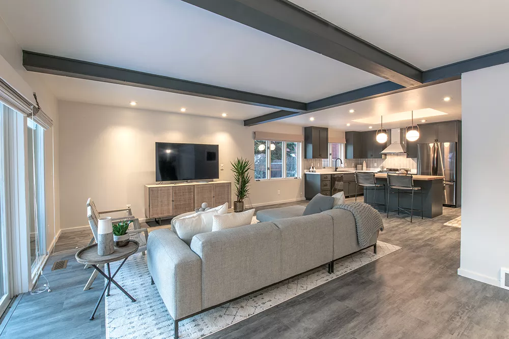 Ornate trim work hid the clean lines of Jared Lyman's '80s South Hill home. Removing the trim and installing new kitchen cabinets and counters helped create a revitalized space. - ERICK DOXEY PHOTO