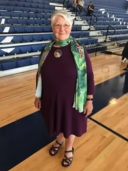McClain's mother Charlotte Lamp smiles while wearing her Space Day Spokane badge. - JACKSON ELLIOTT PHOTO