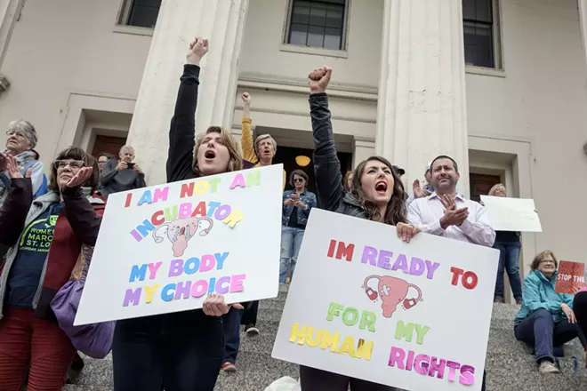 Sabra Harris, left, and Charlene Kibbons rally with other abortion rights activists in downtown St. Louis, Mo., on Tuesday, May 21, 2019. The Missouri legislature recently passed a bill that would ban abortion after eight weeks. - WHITNEY CURTIS/THE NEW YORK TIMES