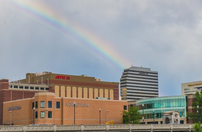 A rainbow leads to the Spokane County Library Wednesday evening - DANIEL WALTERS PHOTO