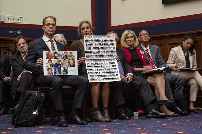 Families of victims of Boeing flight crashes hold names and photos of their dead family members during a Aviation subcommittee hearing of the House Transportation and Infrastructure Committee about the status Boeing 737 MAX airplane, on Capitol Hill in Washington, May 15, 2019. Boeing said on July 3 that it would allocate $100 million to help the families and communities affected by the recent crashes of two of its 737 Max jets. - AMR ALFIKY/THE NEW YORK TIMES