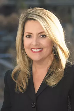 Mayoral candidate Nadine Woodward doesn't think the city should rush to buy space for a homeless shelter.