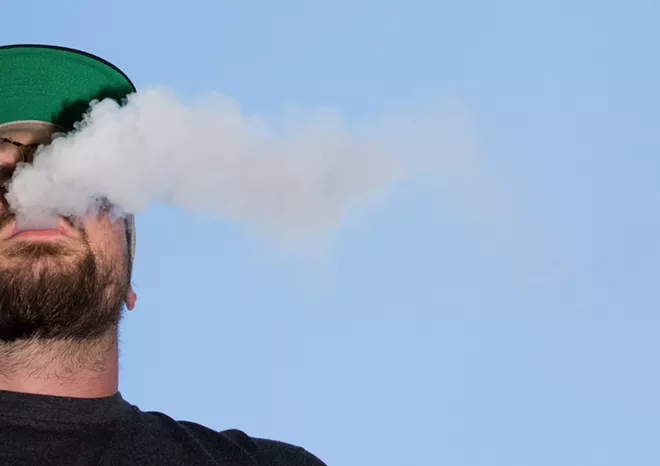 A man uses a vaporizer in Denver, Sept. 13, 2019. The number of people with lung illnesses linked to vaping has risen to 805, from last week’s figure of 530 cases, and 12 people have died, compared to a total of seven last week, the Centers for Disease Control and Prevention reported on Sept. 26. - THEO STROOMER/THE NEW YORK TIMES