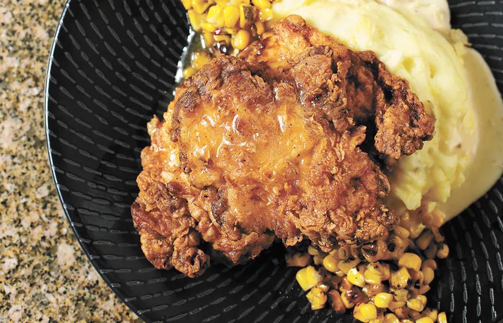 Beverly's fried chicken features truffle honey, Yukon Gold mashed potatoes and skillet roasted corn. - YOUNG KWAK PHOTO