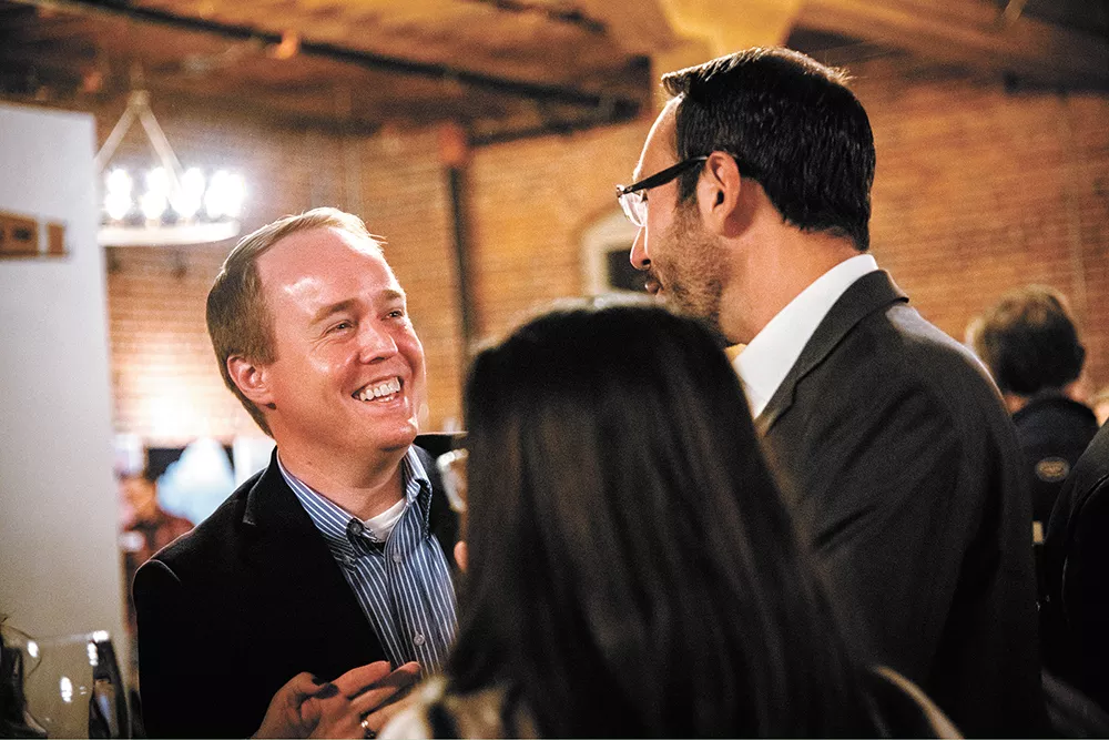 Spokane County Commissioner Josh Kerns, left, celebrates with City Council candidate Michael Cathcart at an election night party at Barrister Winery. - ERICK DOXEY PHOTO