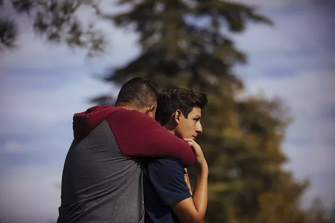 Students are reunited with their parents after a shooting at Saugus High School in Santa Clarita, Calif., on Thursday, Nov. 14, 2019. A 16-year-old student pulled a handgun from his backpack at the school on Thursday morning and shot five students, killing two, the authorities said. The gunman was in grave condition after shooting himself in the head, they said. - DAVID WALTER BANKS/THE NEW YORK TIMES
