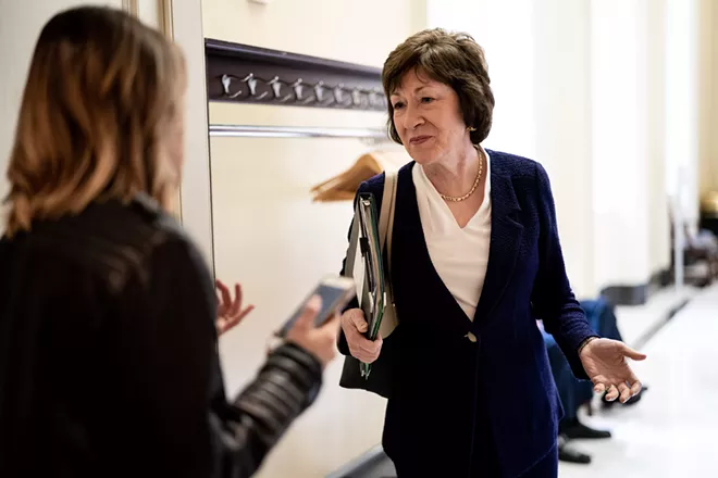 Sen. Susan Collins (R-Maine) talks to a reporter en route to a policy luncheon on Capitol Hill in Washington, Oct. 22, 2019. In a radio interview broadcast on Dec. 30, Collins specifically referenced Sen. Majority Leader Mitch McConnell in criticizing Senate colleagues who “prejudge the evidence” in impeachment proceedings against the president. - ERIN SCHAFF/THE NEW YORK TIMES