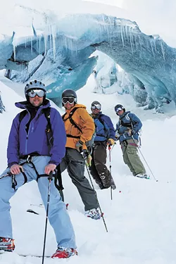 The author rented an RV with three friends (left) to travel the Alaskan highways in search of untouched powder.