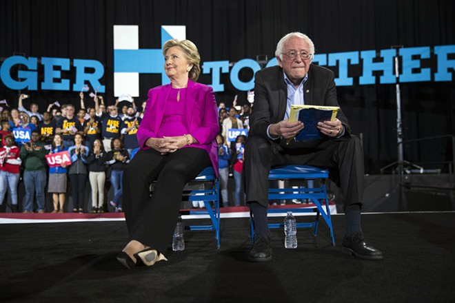 Hillary Clinton, then the Democratic presidential nominee, with Sen. Bernie Sanders (I-Vt.), her former rival for the nomination, at a "get out the vote" rally in Raleigh, N.C., on Nov. 3, 2016. Clinton, who battled with Sanders for months in a Democratic primary that sometimes turned contentious, ripped into her former campaign rival in a new docuseries and declined to say if she would endorse and campaign for Sanders if he were to win the presidential nomination this time around. - DOUG MILLS/THE NEW YORK TIMES