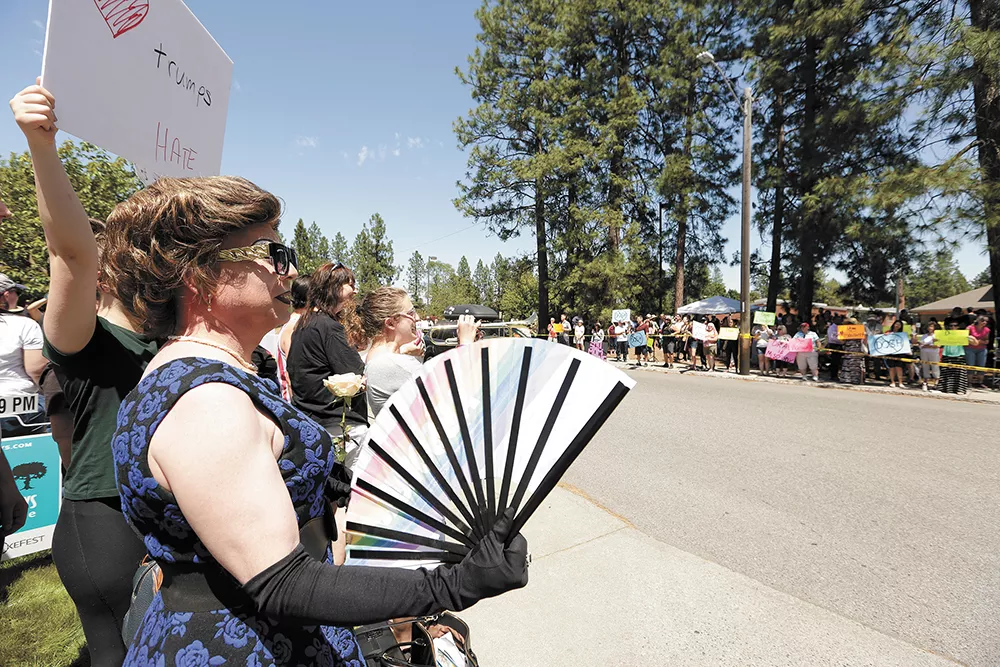 Last year's Drag Queen Story Hour brought out lots of protesters — and police — as well as supporters like Nova Kaine, left. - YOUNG KWAK PHOTO