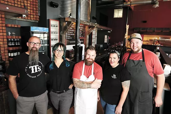 Chef Chad White, center, with the team at TTs Old Iron Brewery & Barbecue, opened in 2019. - YOUNG KWAK