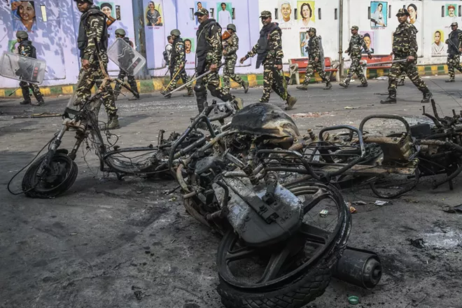 Police officers patrol the streets of Jaffrabad in eastern New Delhi, on Wednesday, Feb. 26, 2020, following protests. Protests erupted in December across the country after Prime Minister Narendra Modi’s government, which has roots in a Hindu-nationalist worldview, passed a new citizenship law that makes it easier for most migrants to become full-fledged Indian citizens unless they are Muslim. - ATUL LOKE FOR THE NEW YORK TIMES