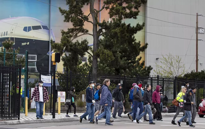Boeing employees leave the property during a shift change at the plant in Renton, Wash., Tuesday, April 28, 2020. The breathtaking slowdown in global aviation is taking a huge toll on Boeing, which said on Wednesday that it would slash about 16,000 jobs after reporting that revenue tumbled by 26 percent in the first three months of the year. - RUTH FREMSON/THE NEW YORK TIMES