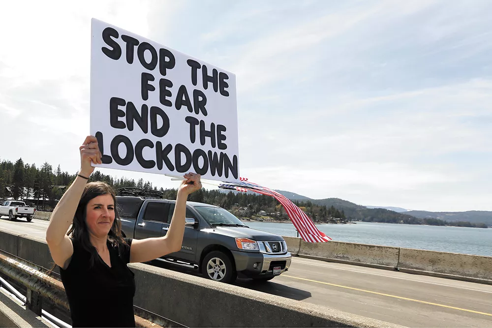 Outside of Sandpoint, Kay Jorissen joined other protesters marching against Idaho's stay-home order on April 17. - YOUNG KWAK PHOTO