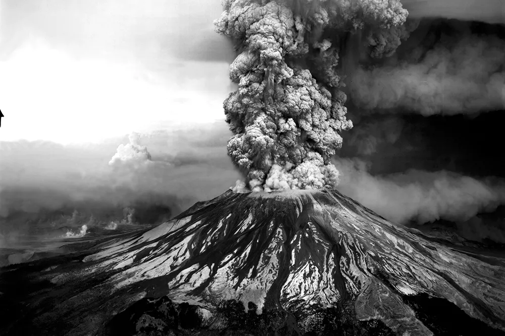 Mount St. Helens continued to spew ash into the sky for nine hours after the initial 8:32 am eruption. This aerial view shows the mountain's southwest side. - ROBERT KRIMMEL PHOTO