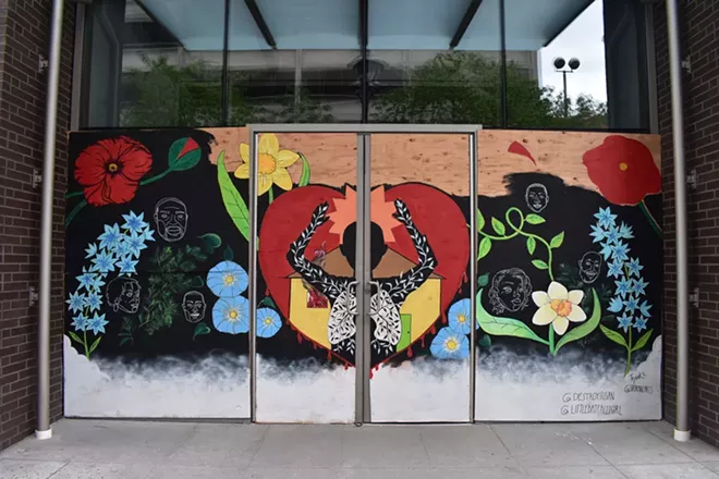 Susan Webber and Shelby Allison worked with Spokane Arts and the Nike store to create this mural, seen here as a work in progress, in downtown Spokane. - JEREMEY RANDRUP PHOTO