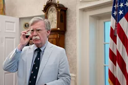 Then National Security Advisor John Bolton in the Oval Office in Washington, July 19, 2019. More than two months before he asked Ukraine’s president to investigate his political opponents, Trump directed John Bolton to help extract damaging information on Democrats from Ukrainian officials, according to Bolton's unpublished manuscript. - ERIN SCHAFF/THE NEW YORK TIMES