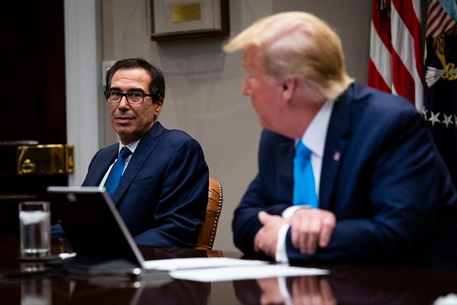 Treasury Secretary Steve Mnuchin and President Donald Trump during an update on the coronavirus small business relief plan at the White House in Washington, April 7, 2020. - DOUG MILLS/THE NEW YORK TIMES