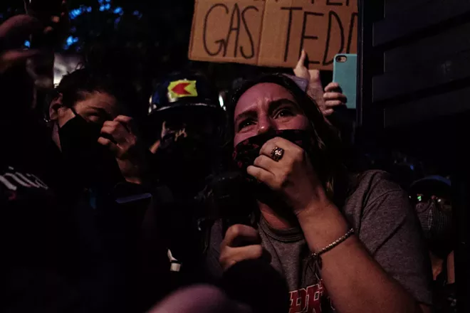 Demonstrators expressed their frustrations with Portland Mayor Ted Wheeler when he visited the protest zone late Wednesday, July 22, 2020 in Portland, Ore. Fueled by a wide array of grievances, including against police brutality, protests have rocked Portland for eight weeks. - MASON TRINCA /THE NEW YORK TIMES