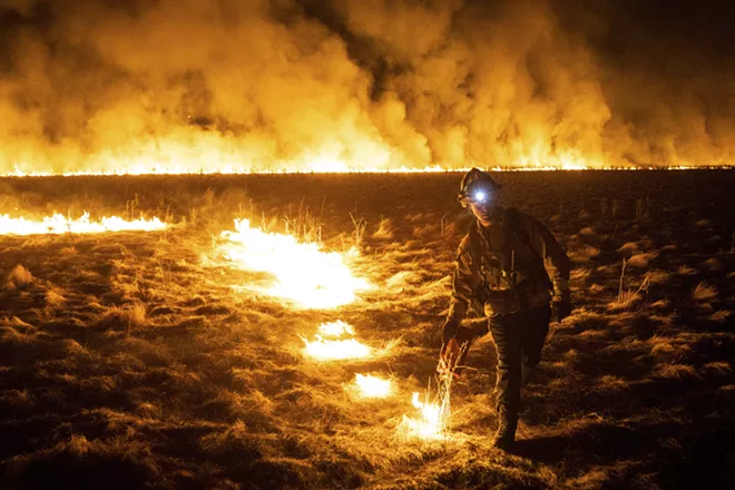 Luke Iott, a Vacaville firefighter, burns a field ahead of a wildfire in Fairfield, Calif., Aug. 19, 2020. Thousands of people were forced to flee their homes in Vacaville, a city of about 100,000 residents near Sacramento, as a combination of uncontrolled fires continued to threaten Northern California on Wednesday. - MAX WHITTAKER/THE NEW YORK TIMES