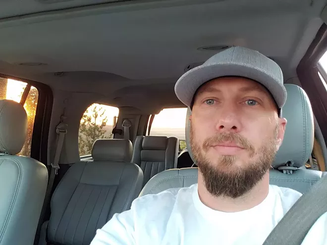 Jeremy Logan, Spokane's co-chair of the Democratic Socialists of America, claims sheriff's deputies didn't identify themselves when he was picked up on an old warrant. - JEREMY LOGAN PHOTO