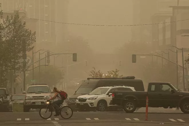 Smoke from wildfires in Washington, Oregon and California obscures downtown Spokane on Saturday. - YOUNG KWAK PHOTO